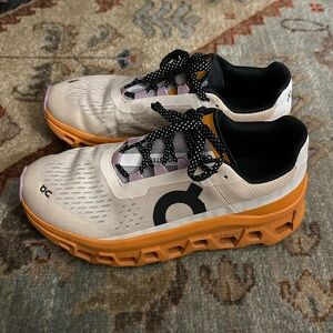 On Cloudmonster in fawn/tumeric in size 7